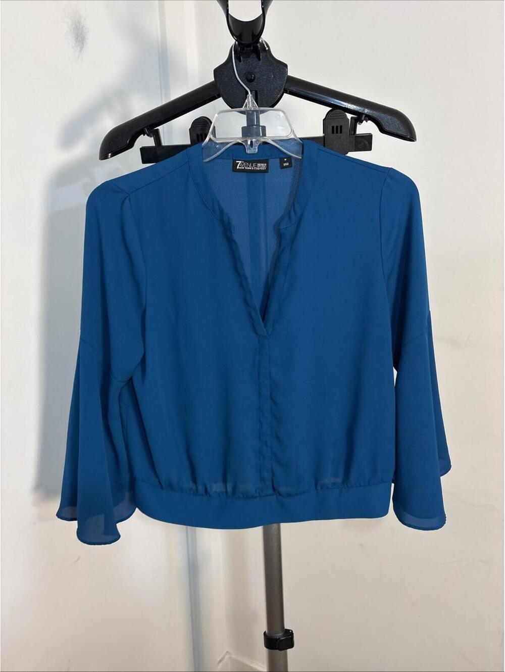 7th Avenue New York & Company blouse featuring a V-neckline and long sleeves